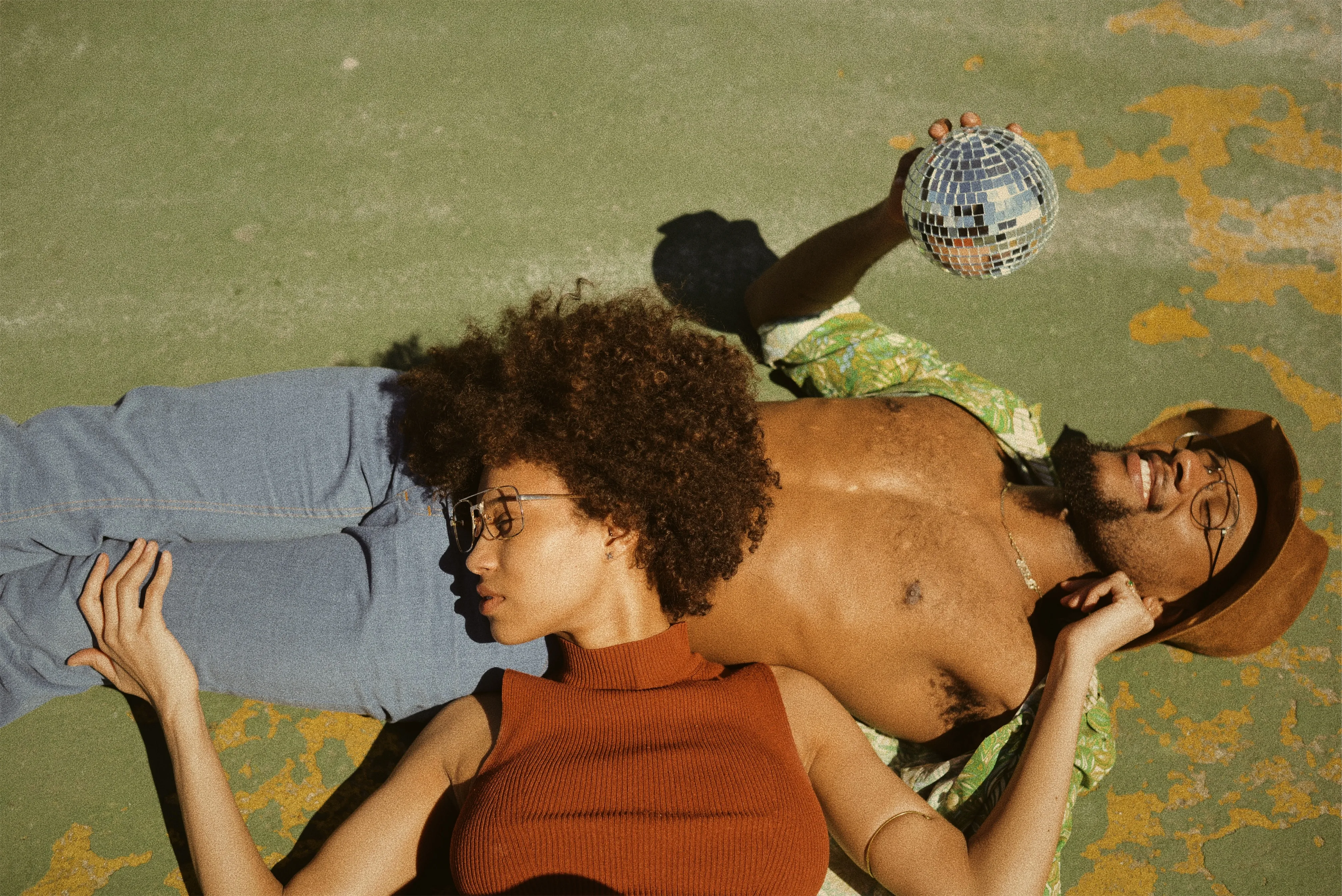 A couple lying in the sunshine